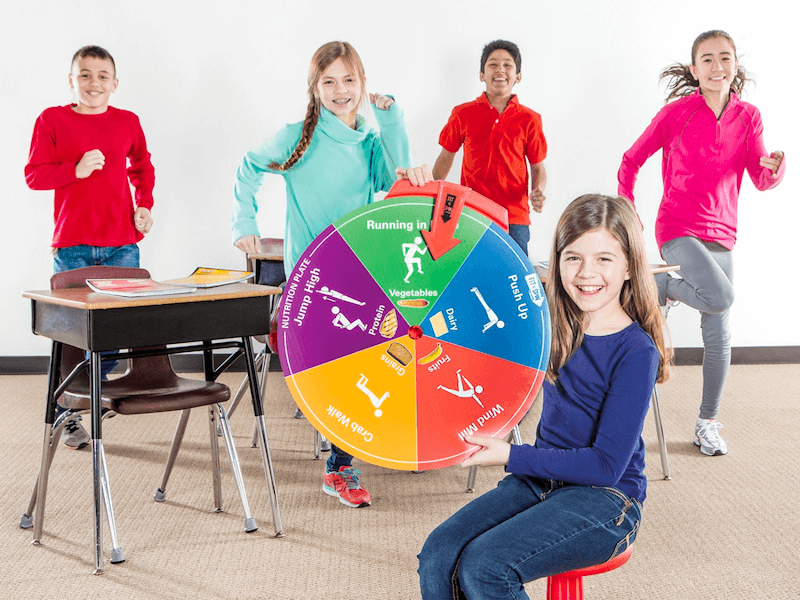 SPARK students spin a wheel to decide what activity they're doing.